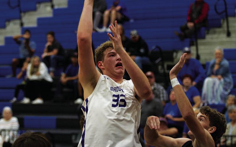Beau Patterson goes up over a China Spring player for two of his 34 points last Saturday. HUNTER KING | DISPATCH RECORD