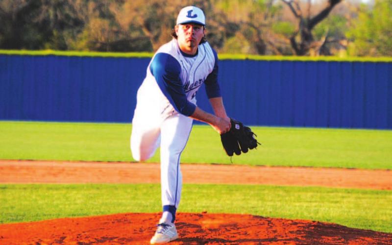 Tak Stinnett throws a pitch in a district game against Brownwood this season. He is expected to be the game one starter on Friday. FILE PHOTO