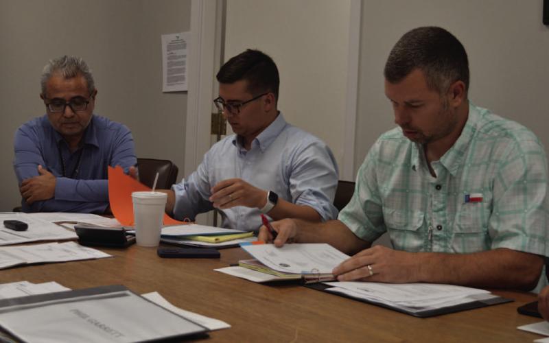 Looking over 2026 budget numbers for the Lampasas Central Appraisal District are, from left, Chief Appraiser Juan Saucedo, MVBA Law managing attorney Nicholas Goettsche and LCAD Board Chairman Marshal Brewer. ERICK MITCHELL | DISPATCH RECORD