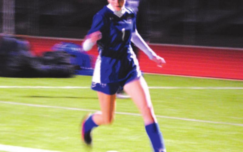 Hailey Palmer dribbles down the left wing during the Lady Badgers’ win over Florence. HUNTER KING | DISPATCH RECORD