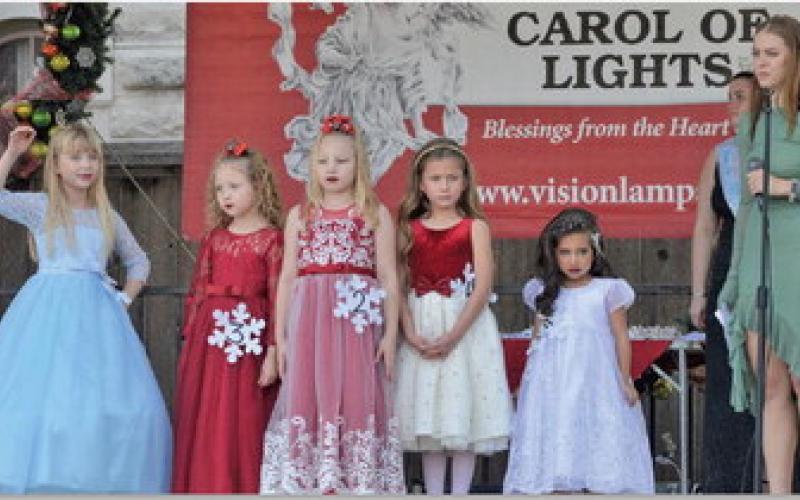 The youngest division of Snow Queen Pageant contestants give the audience one last look before walking off stage during last Saturday’s festivities. ERICK MITCHELL | DISPATCH RECORD