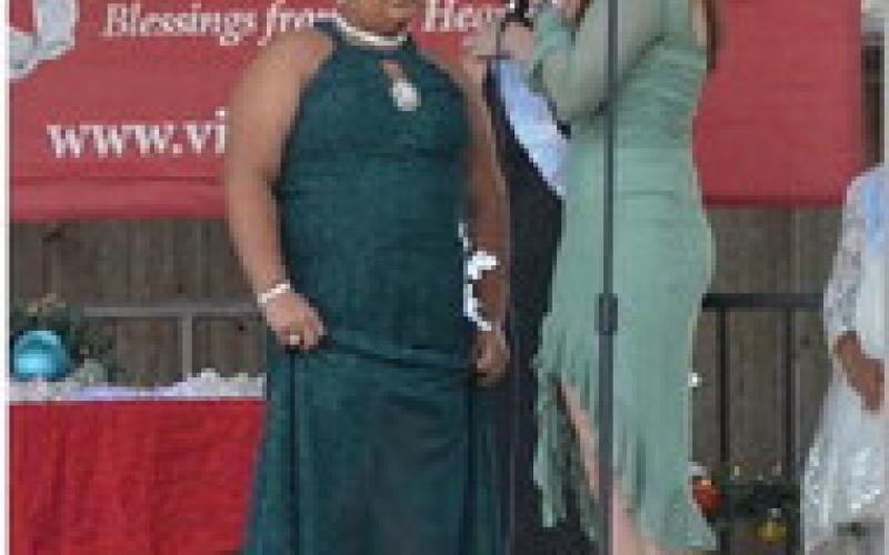 ERICK MITCHELL | DISPATCH RECORD At left, Vera-Rose Johnson answers questions during Saturday’s Snow Queen Pageant. Johnson was named Snow Queen in the intermediate division and also received the pageant’s Humanitarian Award.