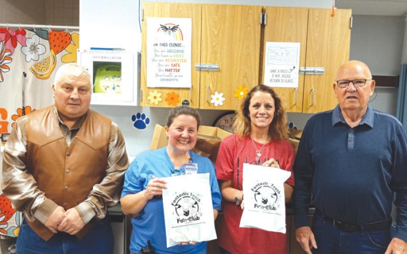 Saratoga Masonic Lodge #546 brought dental kits to Hanna Springs Elementary School first-graders last week. Presenting the donation were Lodge members Paul Plourde, left, and Bob Caughron. School nurses Ginger Curtis and Tani Parrish will ensure they reach students at the campus. Courtesy photo
