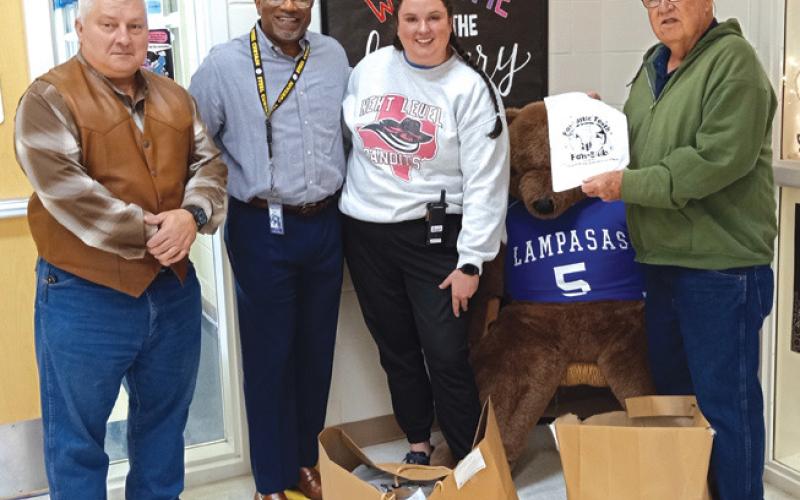 Saratoga Masonic Lodge #546 members Paul Plourde, at left, and Bob Caughron, right, present Taylor Creek Elementary School Principal Mark Sheppard and staff member Billie Shifflett with dental kits for the first-graders at the campus. The donation is part of the “Fantastic Teeth” charitable program offered by Masonic Charities. Courtesy photo