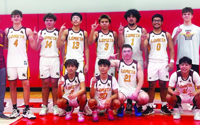 COURTESY PHOTO Hornets’ basketball team poses for a photo at their bi-district playoff game.