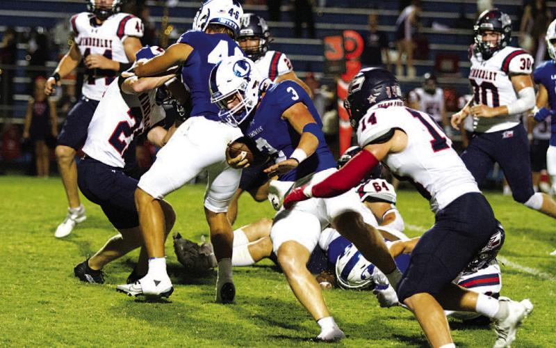 Reed Jerome runs past a Wimberley defender. The senior accounted for four touchdowns last Friday night. HUNTER KING | DISPATCH RECORD