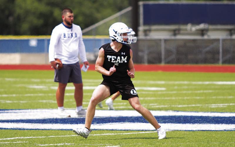 HUNTER KING | DISPATCH RECORD Cale Wheeler drops back into coverage during the team portion of practice.