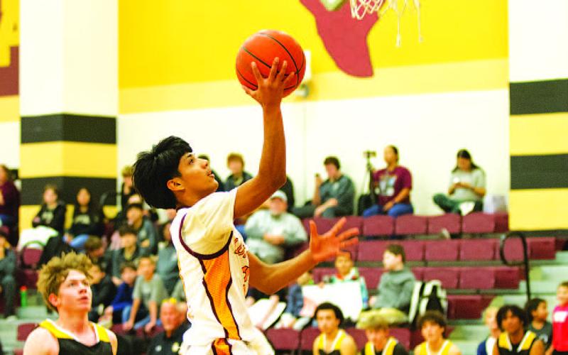 HUNTER KING | DISPATCH RECORD Pablo Carbajal goes up for a layup during the Hornets’ win over Santa Anna last Friday.
