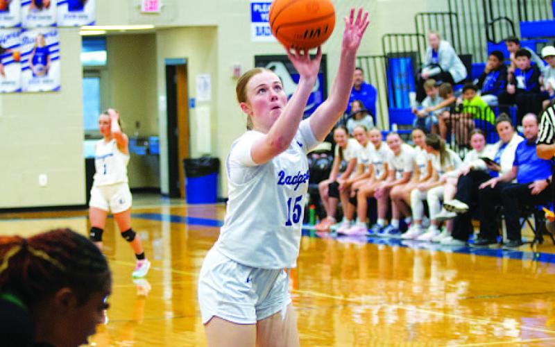 Kari Kepler shoots a free throw for one of her 10 points in the contest. HUNTER KING | DISPATCH RECORD