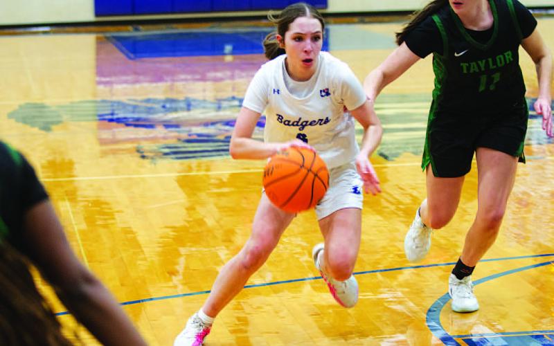 Kase Bumpus drives into the lane against the Taylor Lady Ducks on Wednesday. HUNTER KING | DISPATCH RECORD