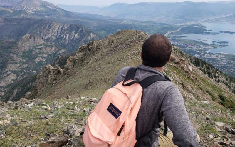 Chris Murrell takes in the view from the ridge line of Peak One in Summit County, Colorado. ALEXANDRIA RANDOLPH MURRELL | COURTESY PHOTO