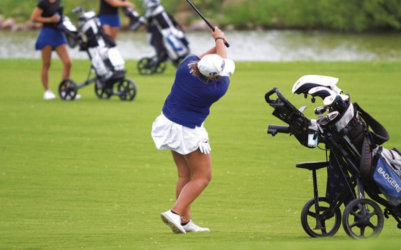 HUNTER KING | DISPATCH RECORD Arianna Gonzalez follows through on an approach shot at Legends Golf Club in Kingsland.