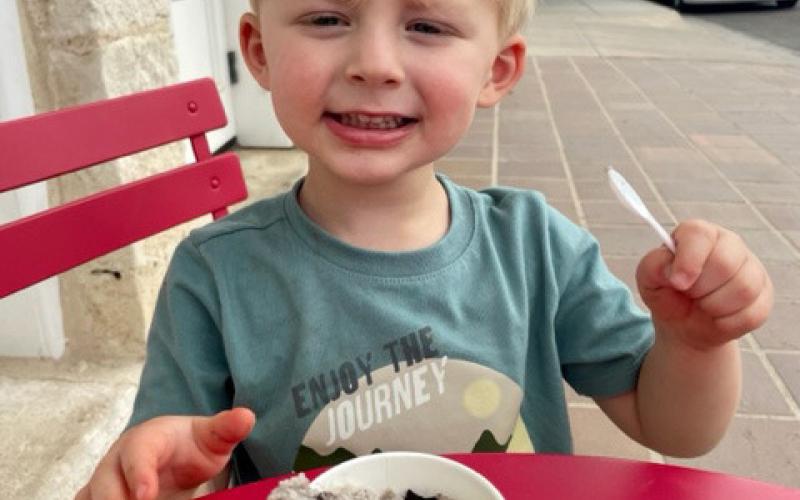 Two-year-old Briggs Perryman knows the best way to beat the summertime heat is with a big scoop of ice cream. Daytime highs remain around the century mark, with no rain predictions in sight. JOYCESARAH MCCABE | DISPATCH RECORD