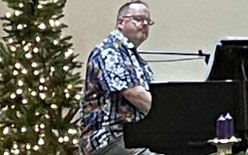 Music teacher and composer Neill Herndon offered a concert for the DRT chapter after its Christmas dinner last week. courtesy photo