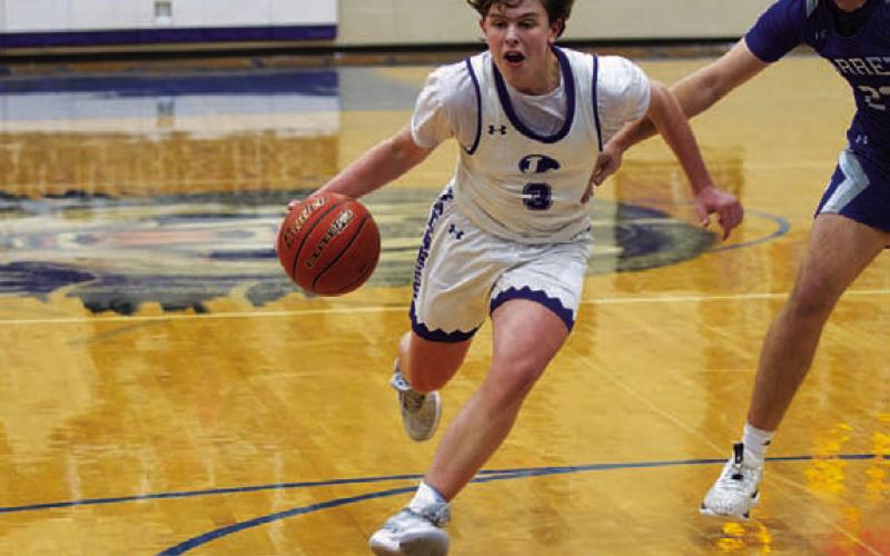 Aidan Nuckles drives into the paint during Tuesday’s game. HUNTER KING | DISPATCH RECORD