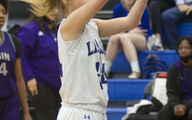 Jamie Ball follows through on a free-throw attempt. HUNTER KING | DISPATCH RECORD