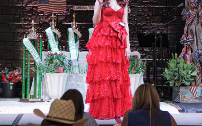 Kirra Rae Hunter waves as she enters the stage. ADAM BARRIOS | DISPATCH RECORD