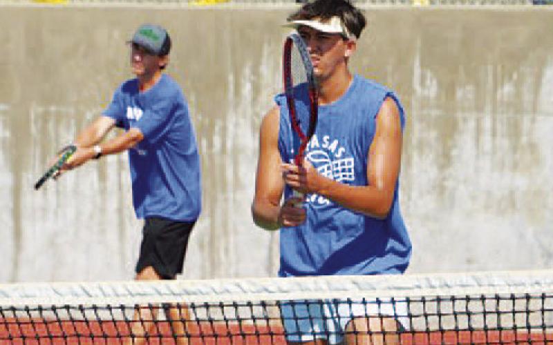COURTESY PHOTO | KENNETH PEISER Tyler Ecker prepares to serve as Clyde Ashfield plays at the net.