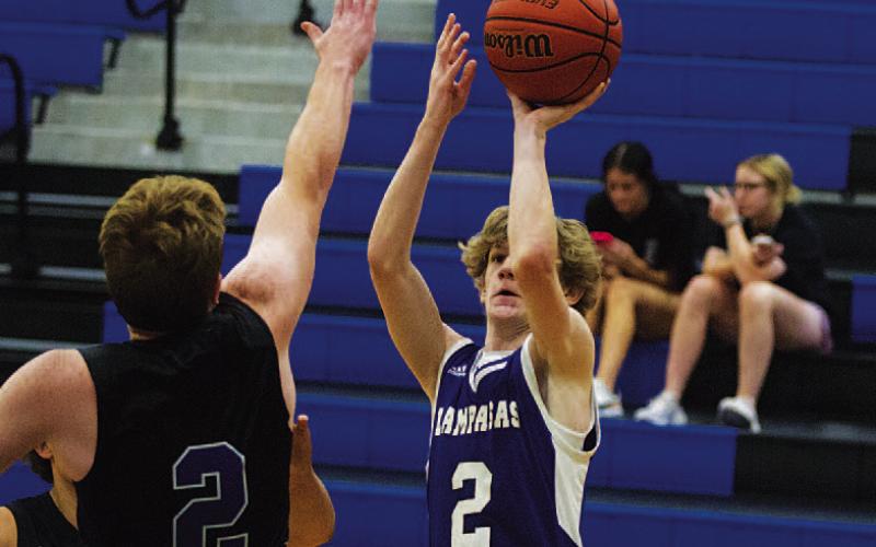 HUNTER KING | DISPATCH RECORD Peyton Sisson shoots a jumper from the corner.