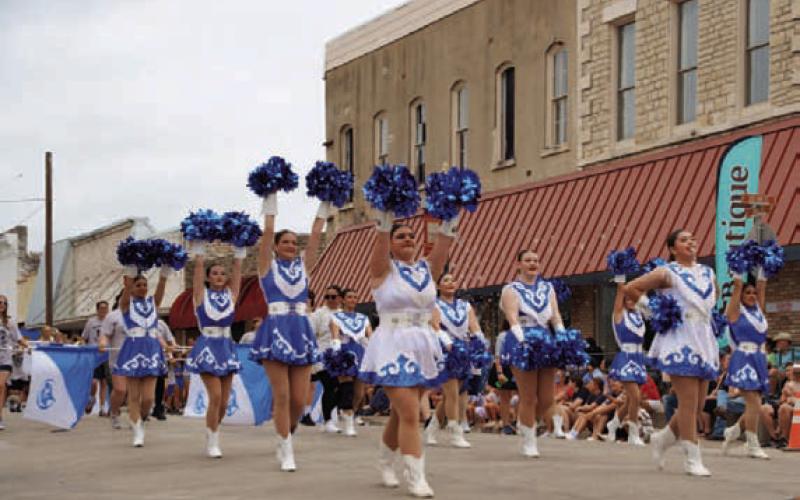 Lampasas cheerleaders dazzle spectators along Third Street during the Spring Ho Parade. ADAM BARRIOS | DISPATCH RECORD