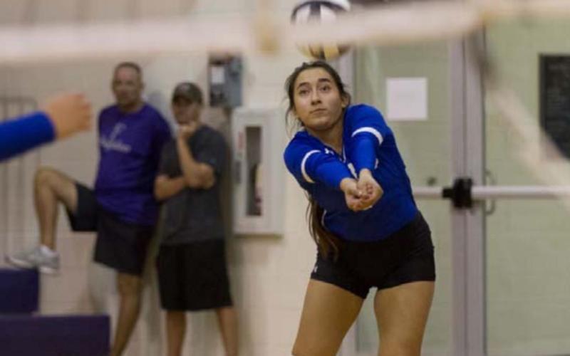 Ethni Sanchez completes a pass to a teammate against Florence on Tuesday. HUNTER KING | DISPATCH RECORD