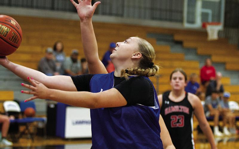 Kennedi Smart attempts a layup through traffic against Hamilton during the final summer league day. HUNTER KING | DISPATCH RECORD