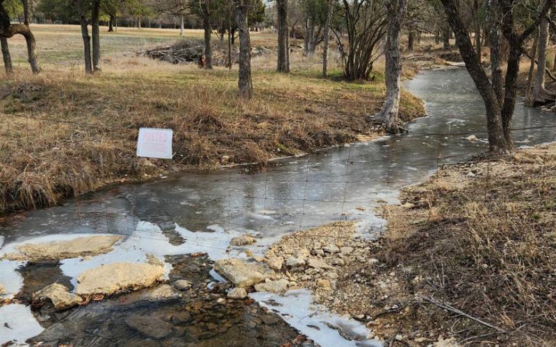 Some snow and icy patches remain visible in shaded areas, as the temperature didn’t rise above freezing in Lampasas until mid-morning Wednesday. This wet-weather creek along South Willis Street still bears signs of the frosty precipitation that fell across the county on Monday. ALLYSSE LOWE | COURTESY PHOTO