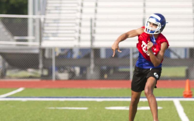 Dylan Sanchez tosses a pass during football practice at Lampasas High School on Tuesday, the second day of practice for the Badgers. HUNTER KING | DISPATCH RECORD