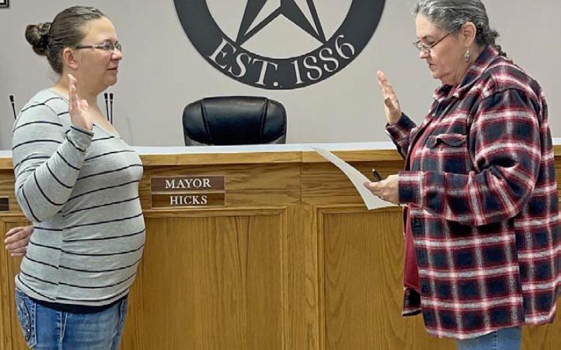 Elizabeth Lambert, left, was sworn in Monday as the new city secretary by Lometa Municipal Court Judge Sharon Watson. MASON HINES | DISPATCH RECORD