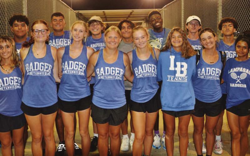 COURTESY PHOTO | KENNETH PEISER The tennis team poses for a photo after claiming the district championship on Tuesday night.