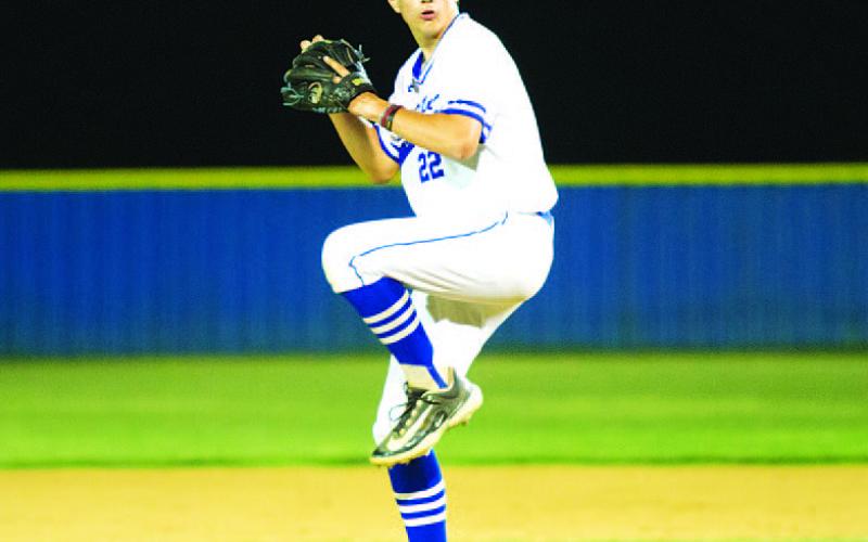 Calvin Phelps winds up to throw a pitch during the bases-loaded jam in the sixth inning. HUNTER KING | DISPATCH RECORD