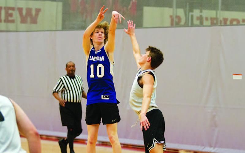Peyton Sisson shoots a three-point shot over a defender during summer league action last week. HUNTER KING | DISPATCH RECORD