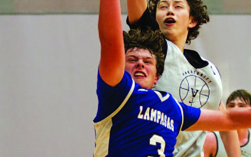 HUNTER KING | DISPATCH RECORD Aidan Nuckles fights through contact to finish at the rim.