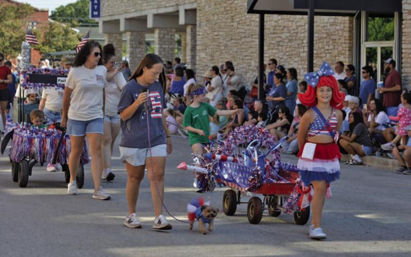Pet Parade participants showed their patriotic spirit with plenty of red, white and blue during last week’s march down Live Oak Street. ERICK MITCHELL | DISPATCH RECORD