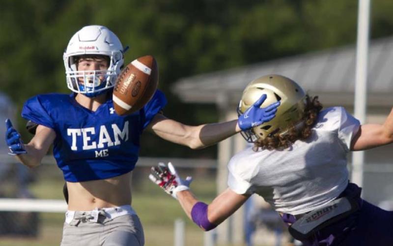 Nate Borchardt catches a deep ball before sprinting for the endzone during the scrimmage Friday with Marble Falls. HUNTER KING | DISPATCH RECORD