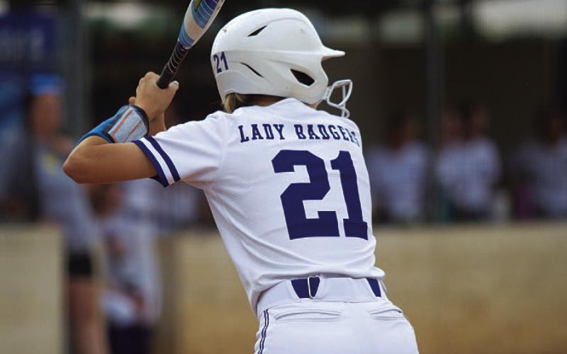 HUNTER KING | DISPATCH RECORD Sagen Plouff prepares to swing in her final playoff series with the Lady Badgers.