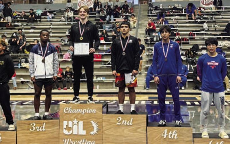 Kaiden Fernandez stands atop the podium at the regional wrestling tournament. COURTESY PHOTO