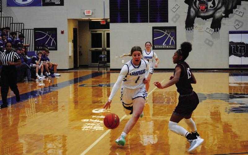Aspen Wheeler drives past a defender on her way to a layup on the fastbreak. HUNTER KING | DISPATCH RECORD