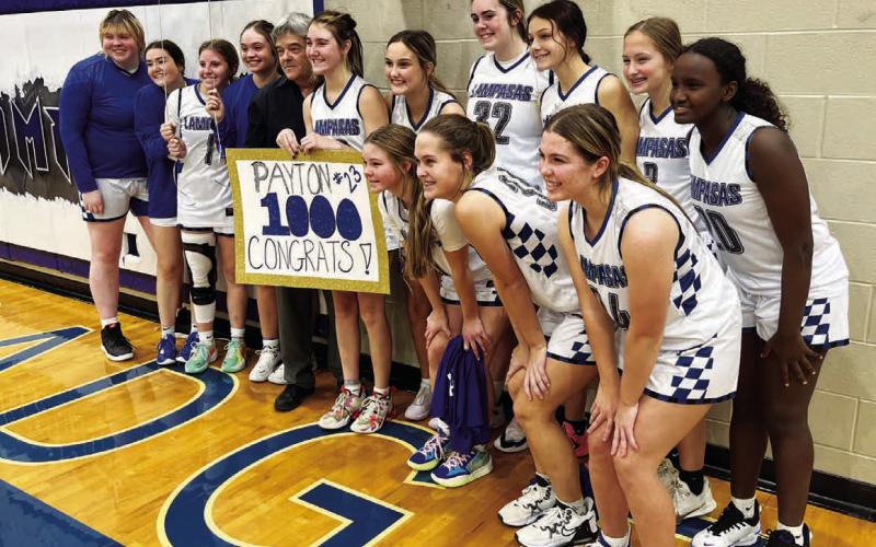 After their win over Killeen, the Lady Badgers celebrate with Payton Tatum, who scored her 1,000th career point on Tuesday. HUNTER KING | DISPATCH RECORD