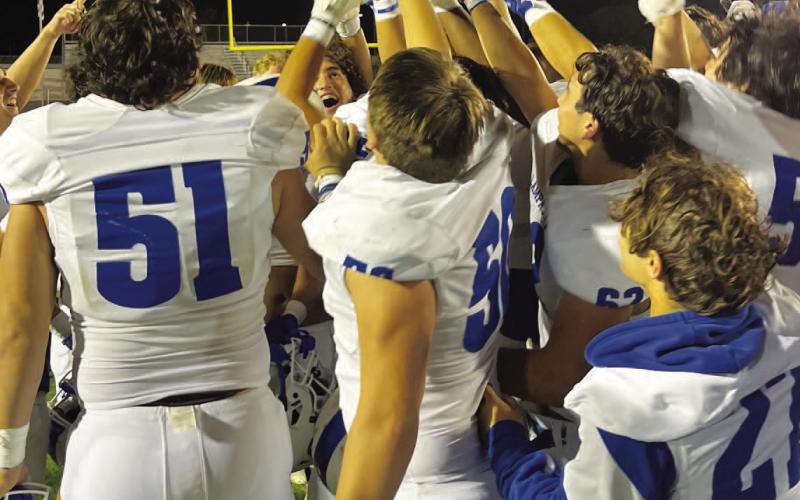 HUNTER KING | DISPATCH RECORD The Badgers hoist the bi-district championship trophy after beating Uvalde last week.
