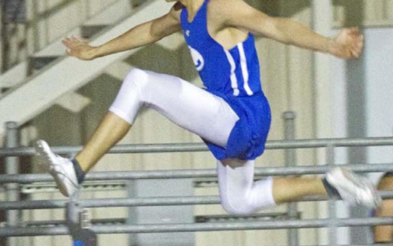 Asa White placed second in the 300-meter hurdles and won the Badger JV’s only gold medal in pole vault in the March 11 meet. JEFF LOWE | DISPATCH RECORD