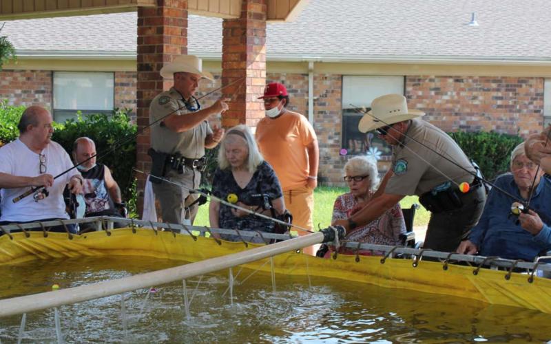 Nursing home holds early Father’s Day celebration with fishing event