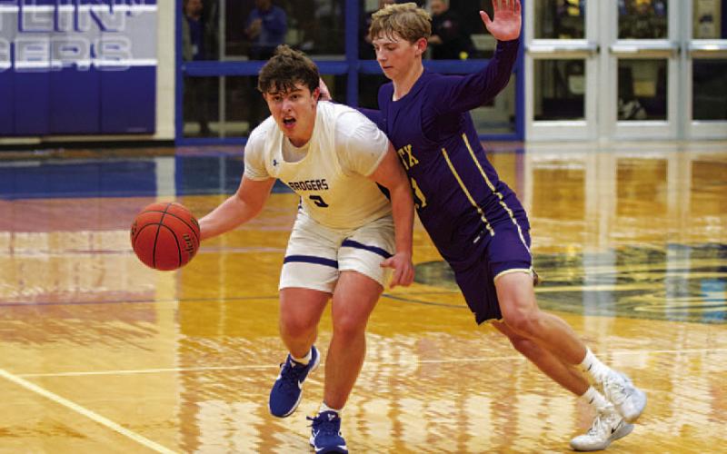 Aidan Nuckles holds off a Marble Falls defender with his body during Tuesday’s game. HUNTER KING | DISPATCH RECORD