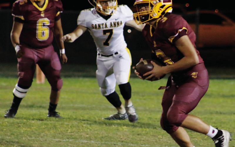 Sophomore Jordan Livesay (3) looks for a receiver downfield. Livesay threw for over 200 yards and 6 touchdowns on Friday. MASON HINES | DISPATCH RECORD