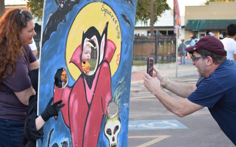 A family enjoys the festivities on the Lampasas courthouse square during the 2021 Squared Silly. FILE PHOTO