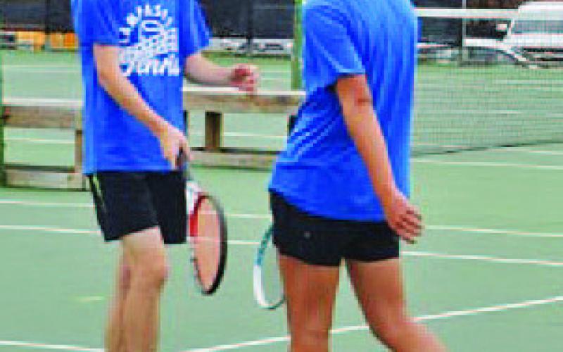 Nate Champion, left, and Clyde Ashfield won a match at the regional tournament. COURTESY PHOTO | KENNETH PEISER