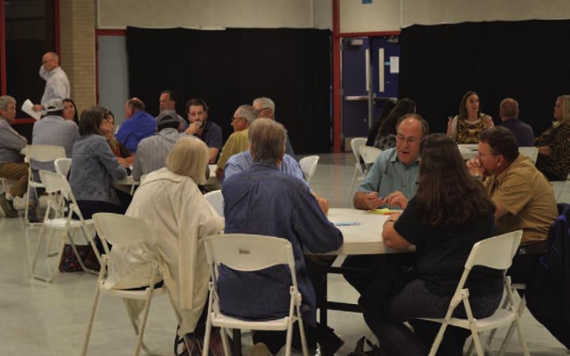 Participants in Wednesday’s community stakeholders meeting break up into small groups to facilitate discussion on ways to improve the city and plan for future growth. ERICK MITCHELL | DISPATCH RECORD