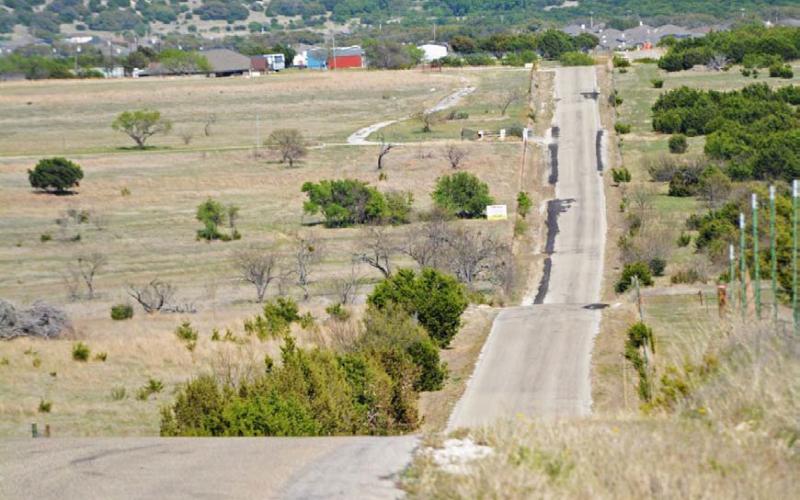 COURTESY PHOTO Portions of County Road 3300 lie in both Precinct 4 and Precinct 1, and it is the most heavily traveled road in Precinct 1, Commissioner Bobby Carroll said.