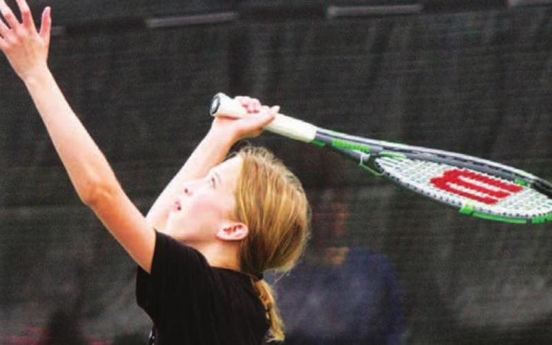 Presley Martin serves during the 2021 tennis camp led by Lampasas High School head coach Kenneth Peiser. FILE PHOTO