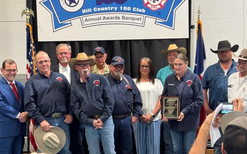 COURTESY PHOTO The Adamsville Volunteer Fire Department was honored by the Hill Country 100 Club for its actions on May 4-5, 2024 to keep area residents safe during widespread flooding when the Lampasas River left its banks. Pictured with the Adamsville VFD is State Sen. Pete Flores, at left.
